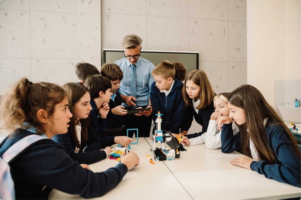 Teacher in conversation with students